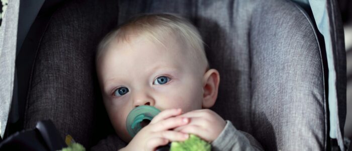 Baby in a car seat - Baby Safety Month